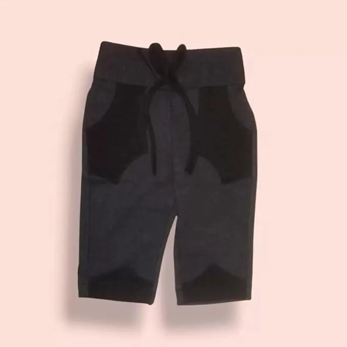 Black kids knee-length shorts with an elastic waistband on a light background