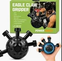 Hand holding a black finger exerciser ball with five spring-loaded finger grips