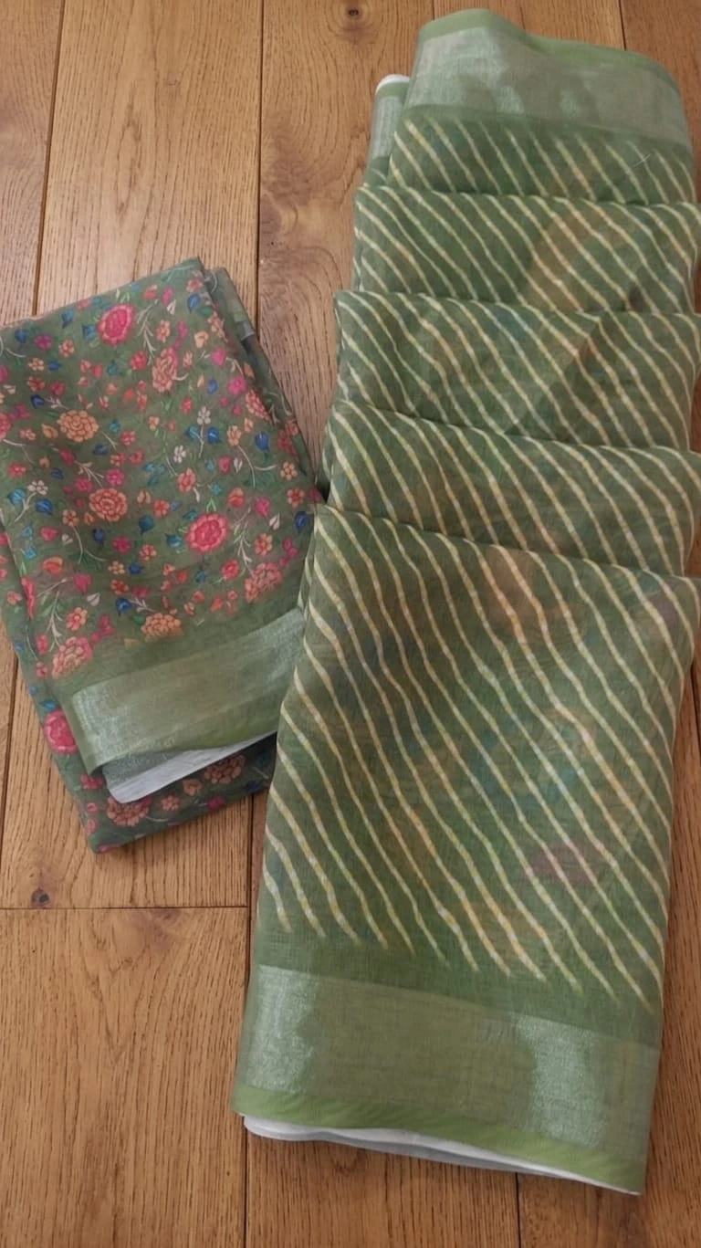 Green silk saree with peacock and floral print, striped pallu and matching blouse piece