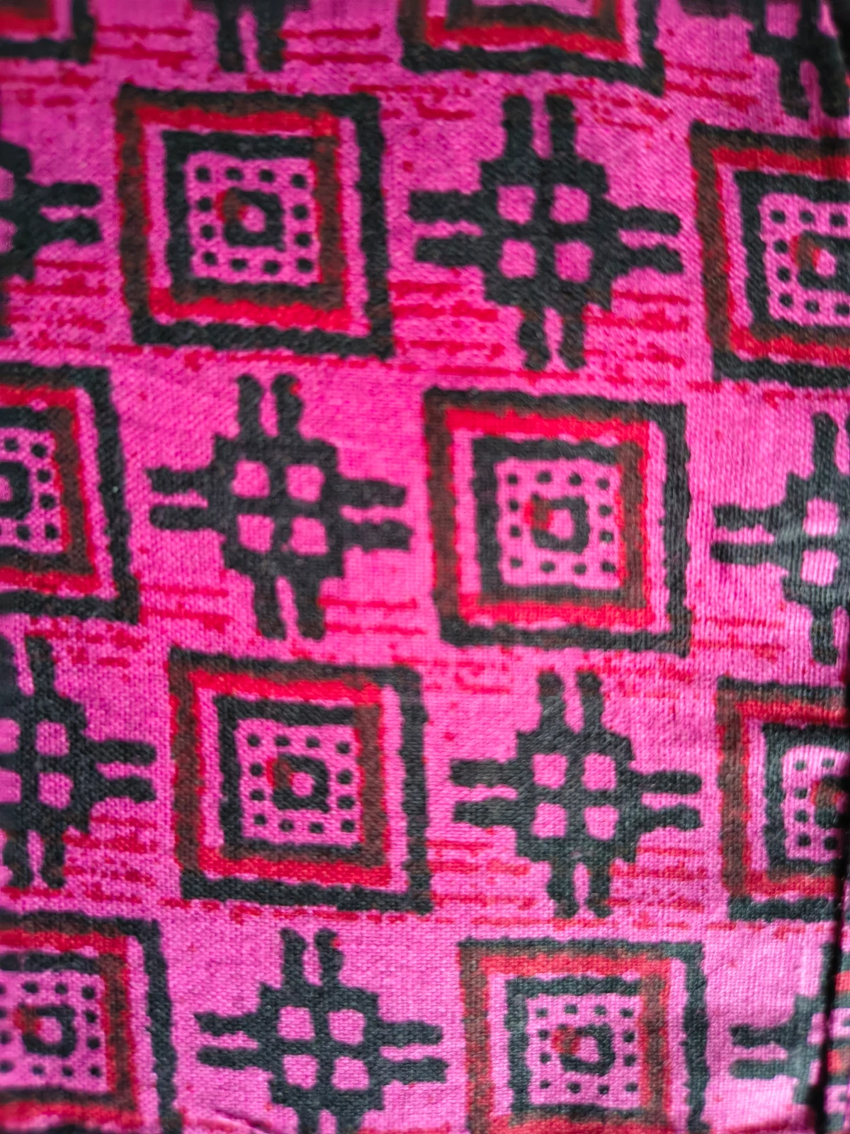 Woman wearing a pink printed full-length nighty with short sleeves and round neck