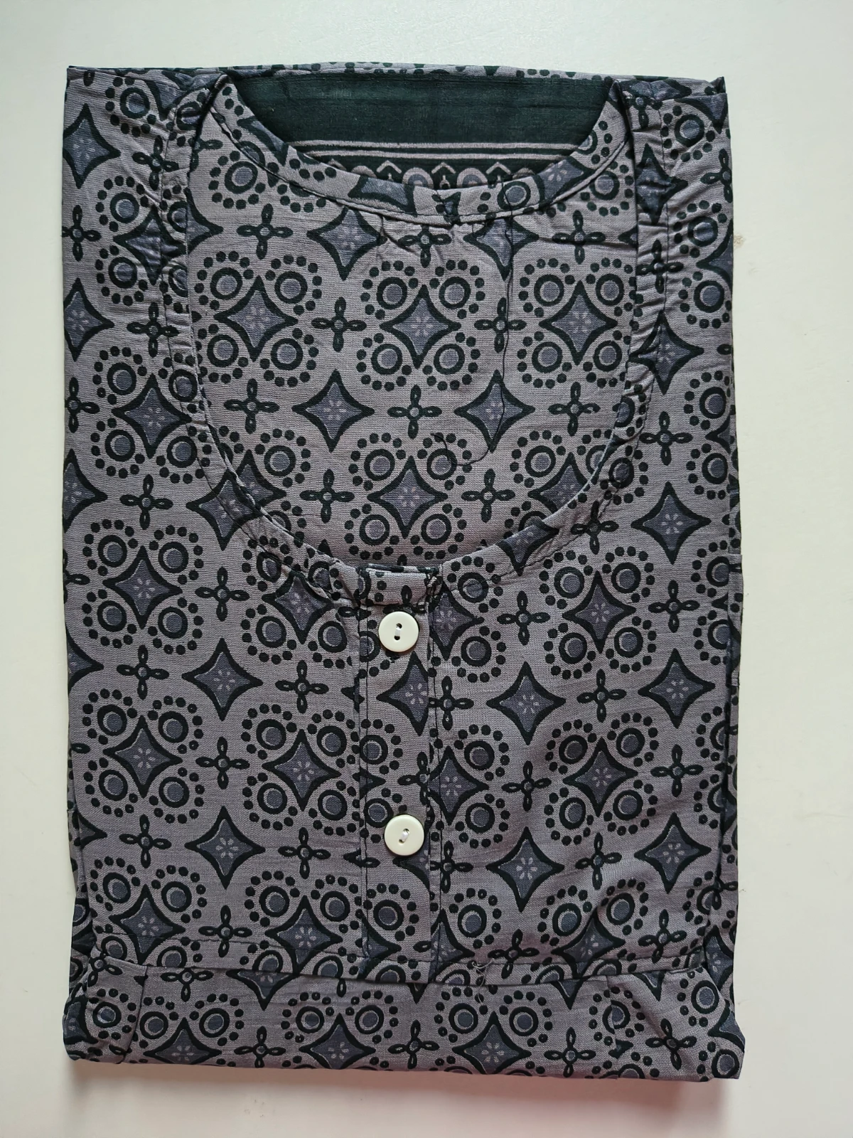Women wearing a grey printed full-length nighty with short sleeves and buttoned round neckline